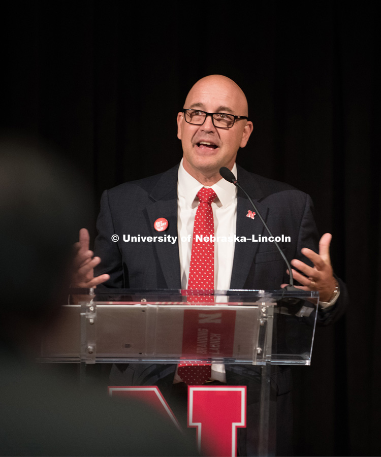Michael Boehm talks to faculty and staff before the big reveal to the students. In Our Grit, Our Glory brand reveal party on east campus at the Nebraska Union. August 31, 2018. Photo by Greg Nathan, University Communication.