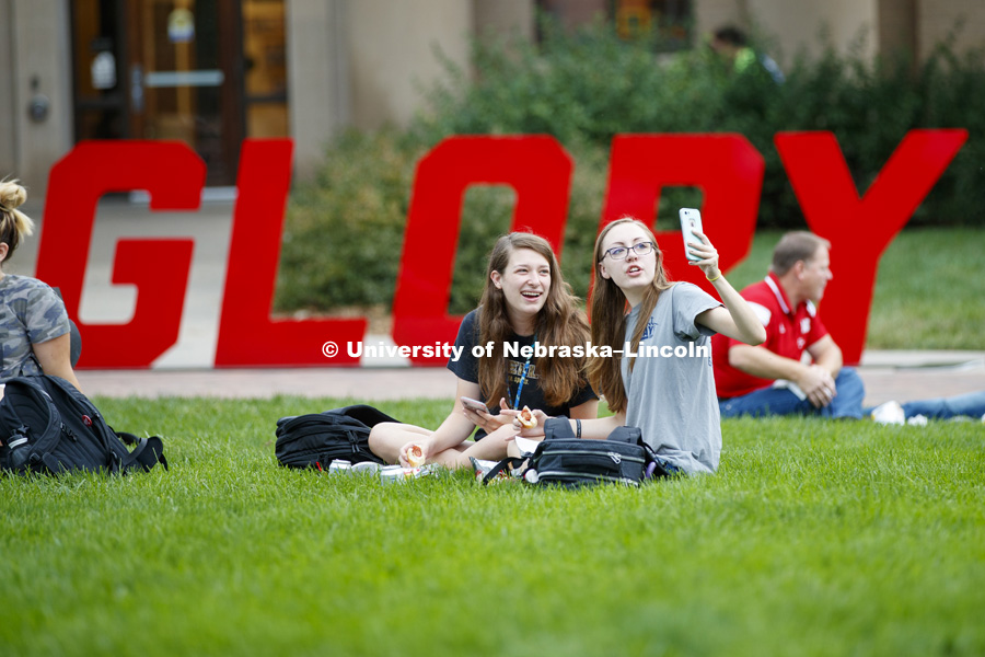 Miranda Mueller, left, and Miranda Hornung take a selfie while enjoying their lunches. In Our Grit, Our Glory brand reveal party on east campus at the Nebraska Union. August 31, 2018. Photo by Craig Chandler / University Communication.