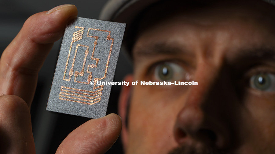Stephen Morin, and graduate student Abhi Konda have reported an easier and cheaper method for painting circuits on curved, textured and stretchable surfaces. September 20, 2018. Photo by Craig Chandler / University Communication.