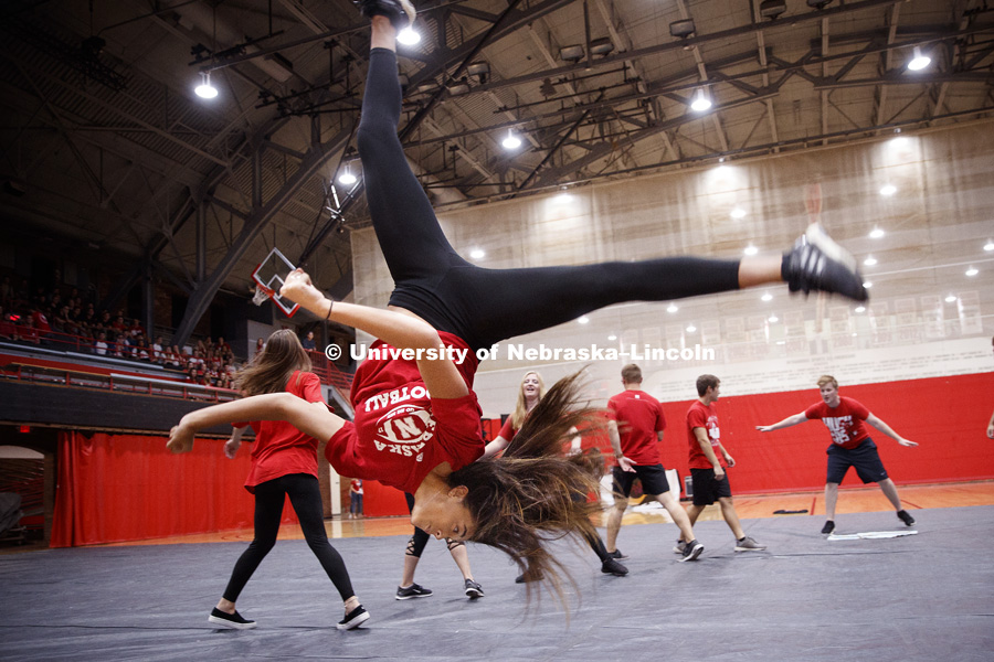 Kiara Kearney, Alpha Omicron Pi, eyes the ground as she does a flip during the Huskers Have Talent show in the Coliseum as part of Homecoming Week. September 24, 2018. Photo by Craig Chandler / University Communication.
