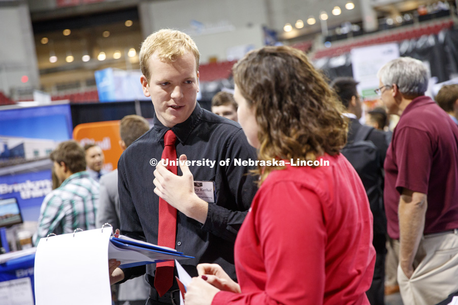 Bradley Kathol talks with recruiter at the STEM Career Fair (Science, Technology, Engineering, and Math) in Pinnacle Bank Arena. September 25, 2018. Photo by Craig Chandler / University Communication.