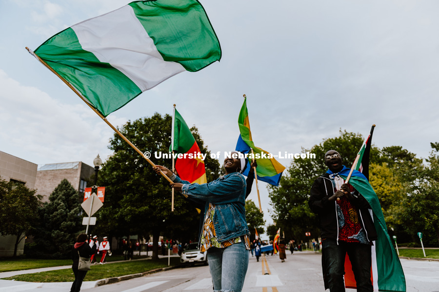 International students from African countries with the Nigerian flags flying, march in the 2018 Homecoming Parade. September 28, 2018. Photo by Justin Mohling / University Communication.