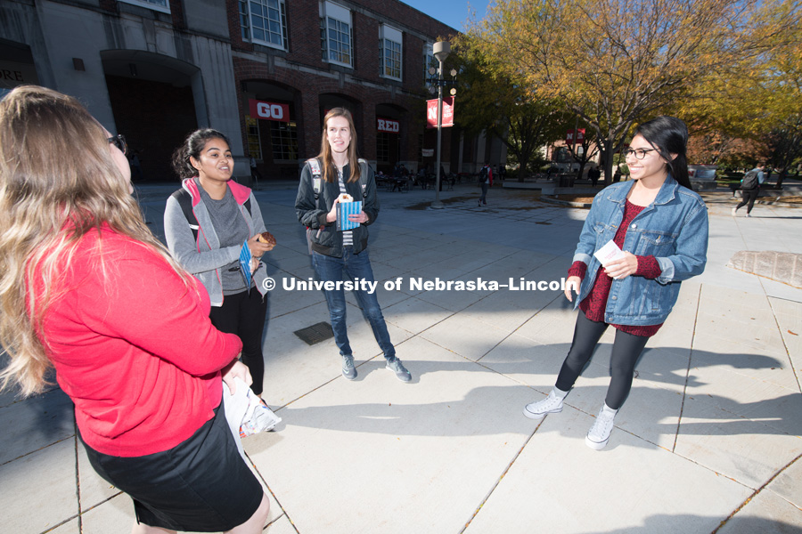 Tabitha Haynes, from the Scholarships and Financial Aid department plays Financial Aid Jeopardy with Dalia Chavez, Sejal Soni, and Samantha Corey outside the Nebraska Union on City Campus. October 17, 2018. Photo by Gregory Nathan, University Communication.