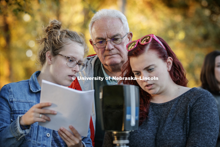 Diane Sherwin, left, and Kelley Stilwell program a 3-D scanner under the watchful eyes of instructor Larry Barksdale. FORS 400 Crime Scene Investigation. Forensics class works at the site of an old house on the north side of east campus. October 22, 2018. Photo by Craig Chandler / University Communication.