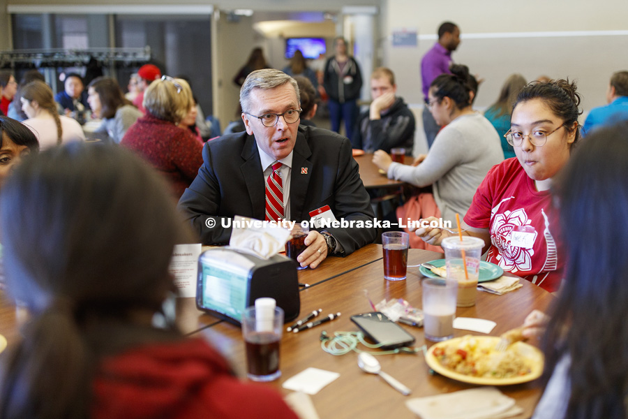 Chancellor Ronnie Green talks with other first generation college students including Annie Romero, a sophomore from Madison, NE. First Gen Nebraska: Share A Meal event at Selleck Dining Hall. October 23, 2018. Photo by Craig Chandler / University Communication.