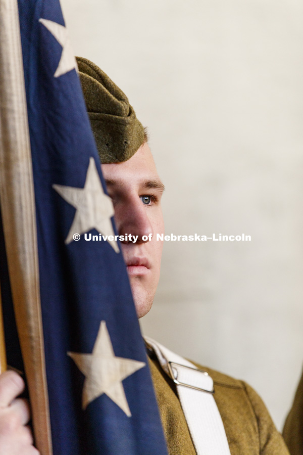 Navy Color Guard ROTC Cadet Christian Neu stands at flag rest during the ceremony. A new display commemorating the World War I service of Nebraskans and University of Nebraska students was dedicated during a November 11 ceremony at Memorial Stadium. November 11, 2018. Photo by Craig Chandler / University Communication.