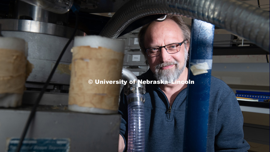 Joe Lutes worked on a two-stage vacuum pump in a lab in Jorgensen Hall. On Dec. 14, Joe will be celebrating his 53rd birthday, and a much bigger milestone — he’ll be finishing a college degree 35 years in the making. December 11th, 2018. Photo by Gregory Nathan /University Communication.