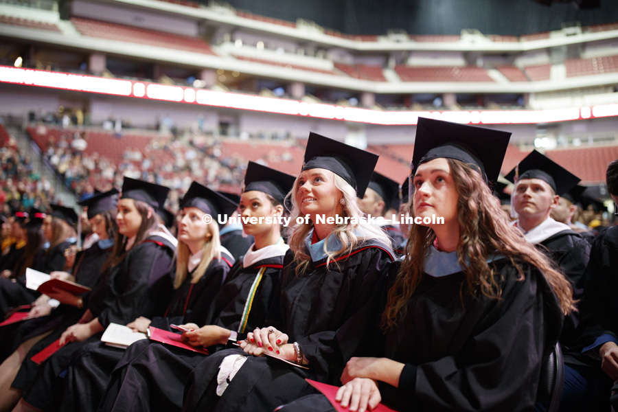 Hillary Hotz, Masters in Educational Administration, watches a welcome video during the Graduate Commencement and Hooding ceremony in Pinnacle Bank Arena. December 14, 2018. Photo by Craig Chandler / University Communication.