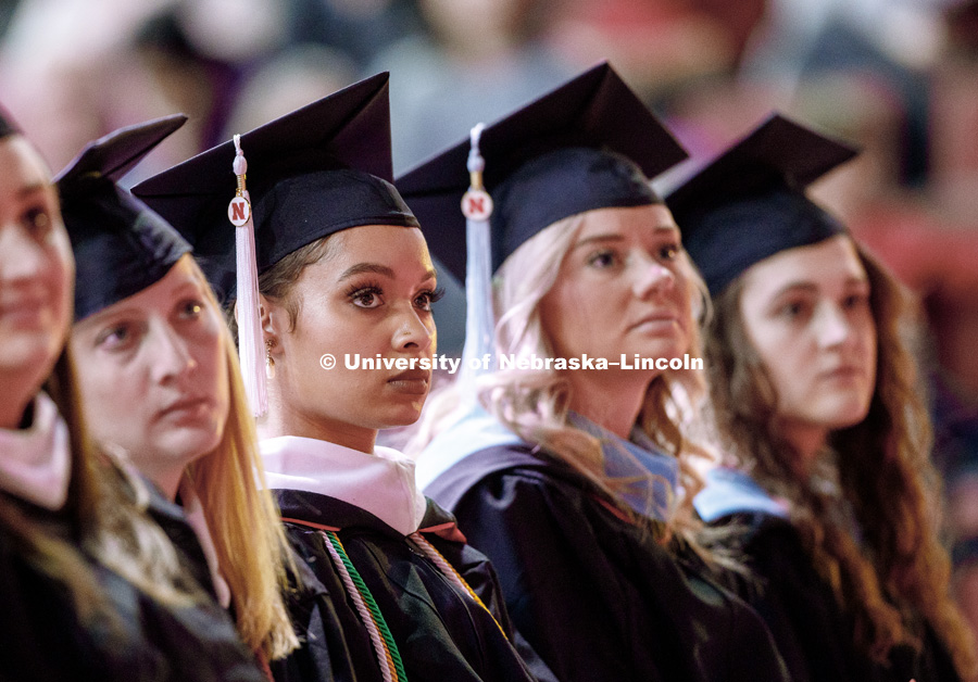 Virginia Hill, Masters in Political Science, listens to the commencement speaker during the Graduate Commencement and Hooding ceremony in Pinnacle Bank Arena. December 14, 2018. Photo by Craig Chandler / University Communication.