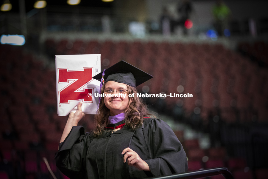 Katelynn Larsen was the final person to walk across state as she received her Master of Architecture degree at the Graduate Commencement and Hooding in Pinnacle Bank Arena. December 14, 2018. Photo by Craig Chandler / University Communication.