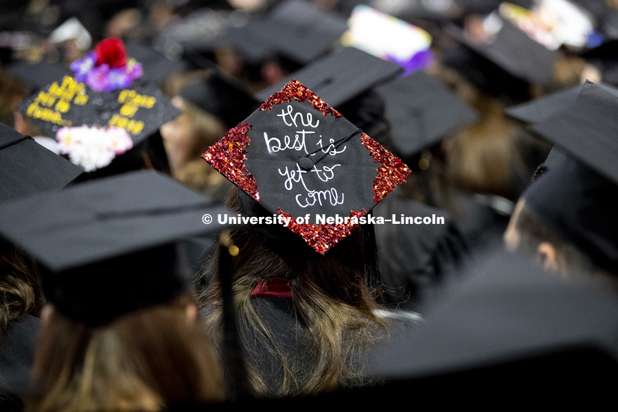 Decorated mortarboards can be seen throughout the crowd at the Undergraduate Commencement in Pinnacle Bank Arena. December 15, 2018. Photo by Craig Chandler / University Communication.