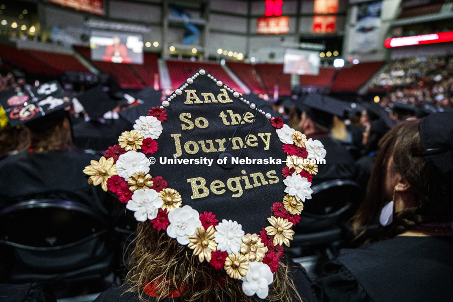 Decorated mortar boards dot the heads of some of the students at the Undergraduate Commencement in Pinnacle Bank Arena. December 15, 2018. Photo by Craig Chandler / University Communication.