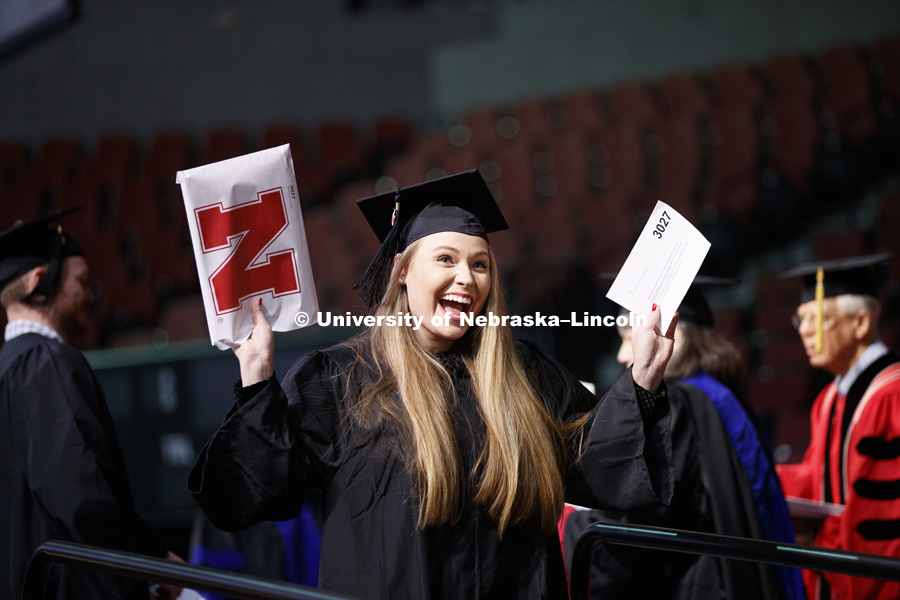 Paige Kennedy shows off her diplomat the Undergraduate Commencement in Pinnacle Bank Arena. December 15, 2018. Photo by Craig Chandler / University Communication.