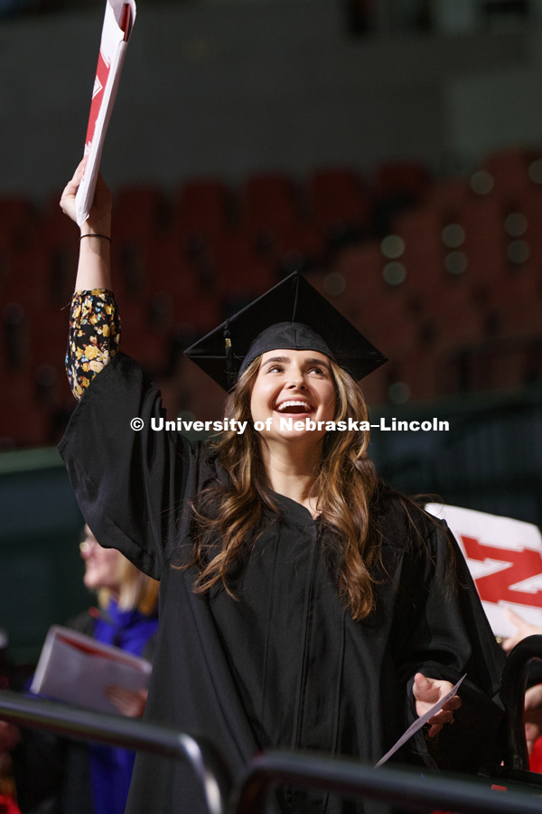 Anastasia Stepanyuk shows off her diploma at the Undergraduate Commencement in Pinnacle Bank Arena. December 15, 2018. Photo by Craig Chandler / University Communication.