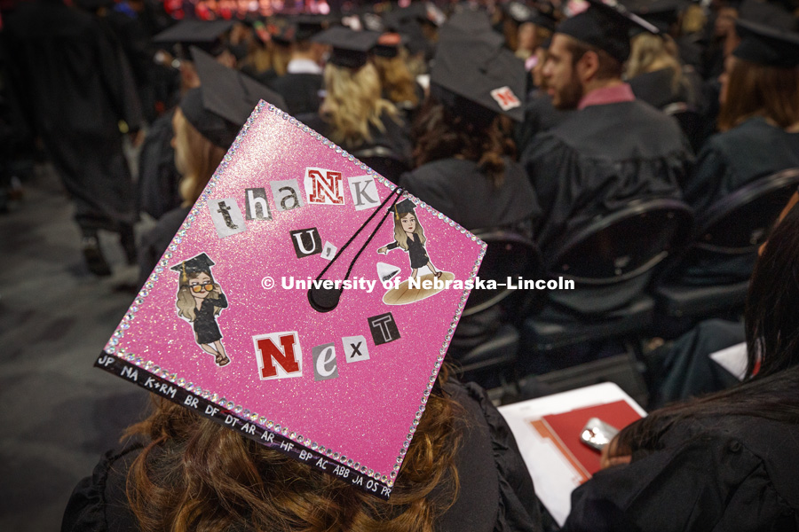 Decorated mortarboards can be seen at the Undergraduate Commencement in Pinnacle Bank Arena. December 15, 2018. Photo by Craig Chandler / University Communication.