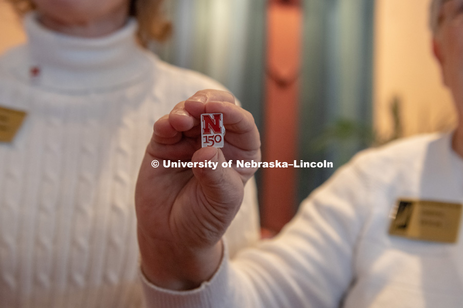 N150 pins were being handed out at the State of the University, January 15th, 2019. Photo by Gregory Nathan / University Communication.