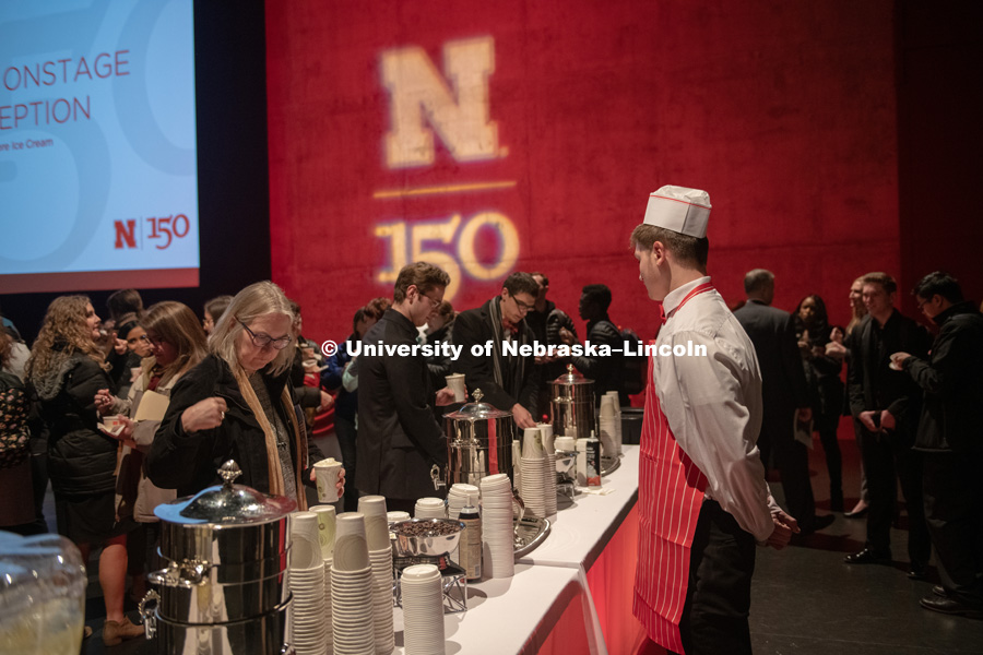 Chancellor Ronnie Green talks with attendees on the Lied Stage. All were invited to a reception on the stage for Nifty 150 Ice Cream and hot chocolate. Ice cream was provided by the Dairy Store. January 15, 2019. Photo by Greg Nathan / University Communication.