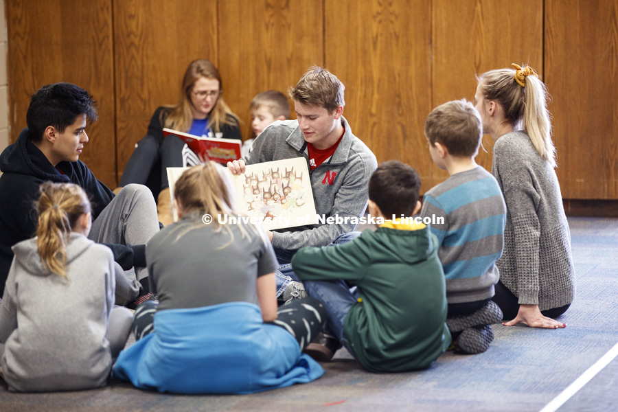 Jacob Polk, freshman in Economics, from Hooper, NE, reads to children at the YMCA of Lincoln-Northeast as part of the Husker Reading Challenge. The UNL students reading at the Y are part of the Chancellor's Leadership Class. Students, faculty and staff are invited to honor King’s legacy through a day of service. In collaboration with Prosper Lincoln and Read Aloud Lincoln, the Center for Civic Engagement at Nebraska will host the reading challenge. January 21, 2019. Photo by Craig Chandler / University Communication.