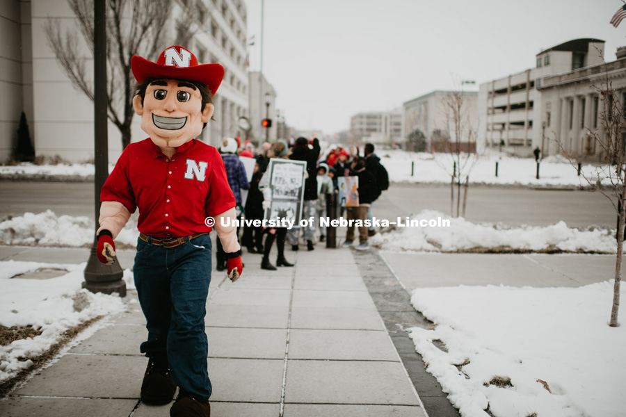 As part of MLK Week, UNL students march with Herbie Husker leading the way in a unifying march through downtown Lincoln and finish with a “Call to Action” program at the Nebraska State Capitol. January 21, 2019. Photo by Justin Mohling for University Communication.