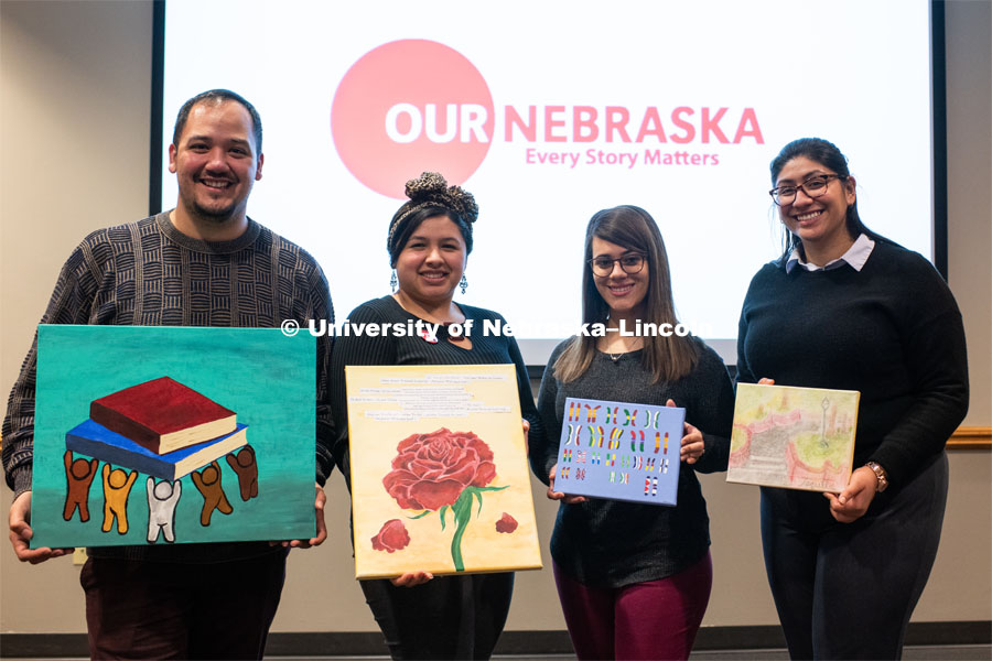 Our Nebraska: Express Yourself Expo in the Oasis Center. Students holding their artwork in front of the event logo. January 31, 2019. Photo by Justin Mohling / University Communication.