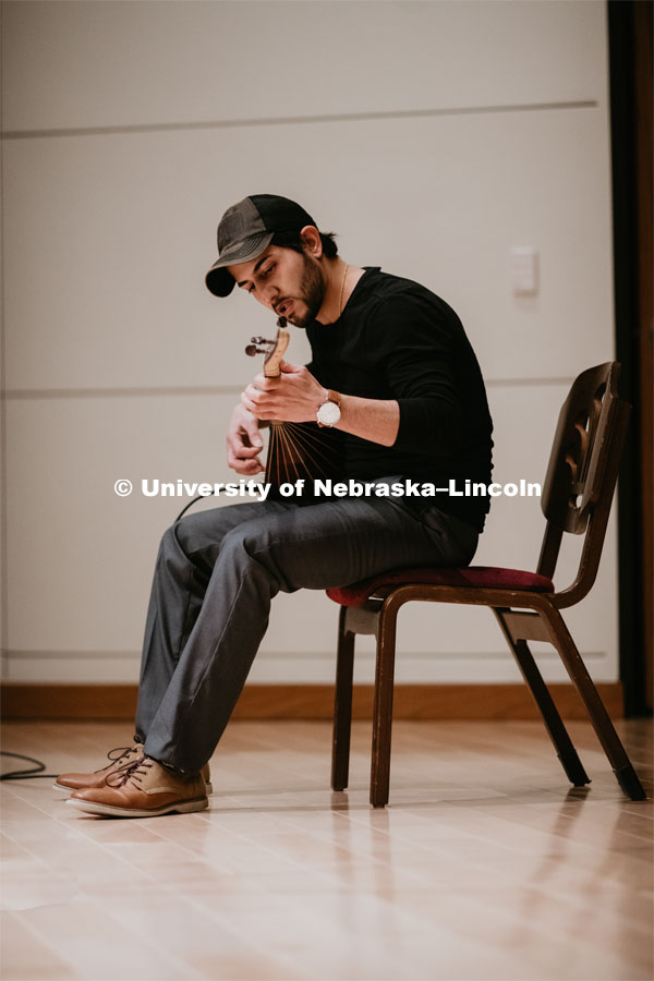 Our Nebraska: Express Yourself Expo in the Oasis Center. A Turkish student plays a sting instrument for the Expo. January 31, 2019. Photo by Justin Mohling / University Communication.