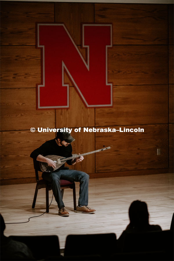 Our Nebraska: Express Yourself Expo in the Oasis Center. A Turkish student plays a sting instrument for the Expo. January 31, 2019. Photo by Justin Mohling / University Communication.