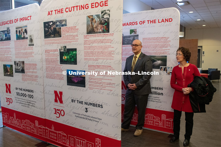 Michael Boehm and Michelle Waite, part of the Chancellor's Executive Team, look over the traveling history exhibit in the Student Union. February 11th, 2019. Photo by Gregory Nathan / University Communication.