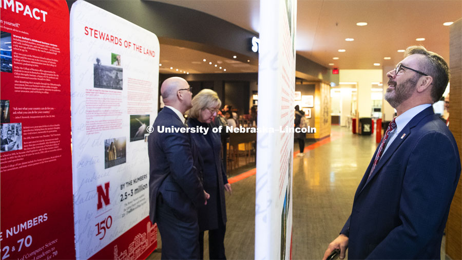 Chancellor Ronnie Green, right, Mike Boehm, Vice Chancellor of Institute of Agriculture and Natural Resources and Executive Vice Chancellor Donde Plowman look over the traveling history exhibit in Nebraksa Union. February 11, 2019. Photo by Craig Chandler / University Communication