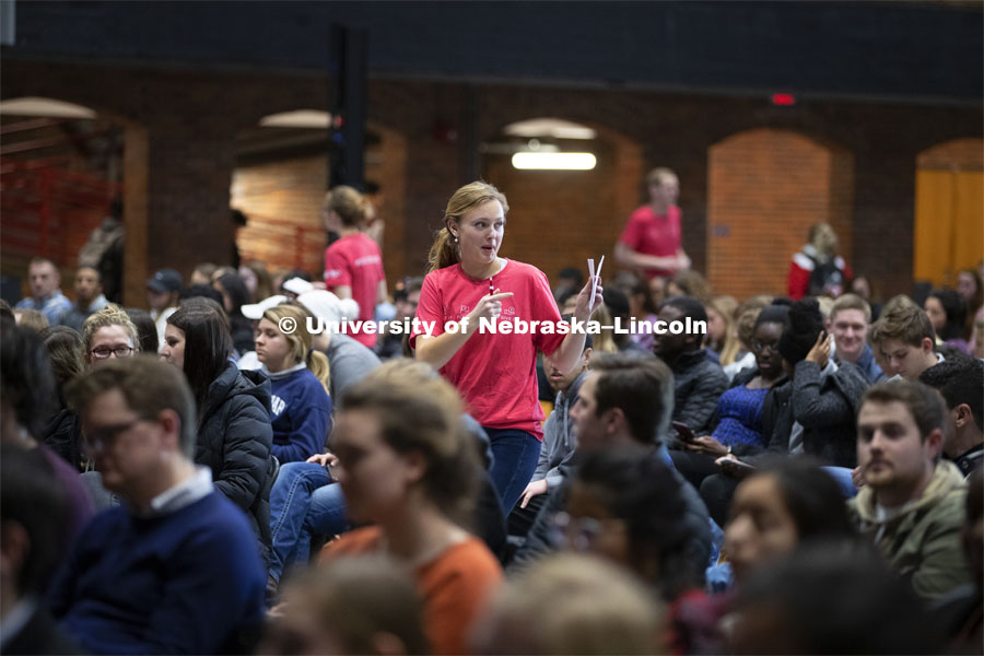 Student volunteers offer the crowd paper to write their questions for the panel. The Charter Week event, “Why Don’t We Get Along? How Huskers Can Change the Future: A Student-led Conversation with Senator Ben Sasse”. February 11, 2019. Photo by Craig Chandler / University Communication.