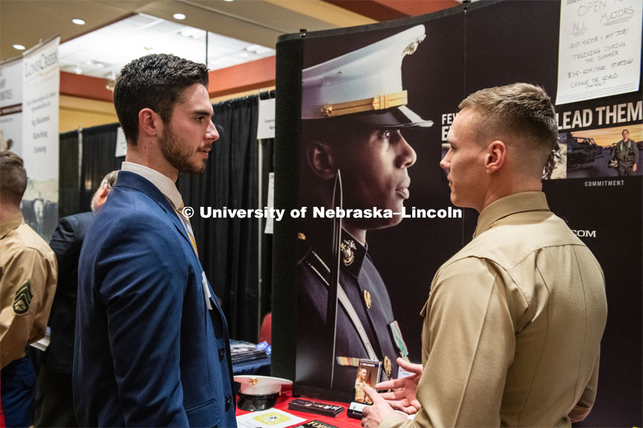 Taylor Gannon talks with a recruiter from The US Marines at the STEM Career Fair (Science, Technology, Engineering, and Math) in Embassy Suites. Sponsored by Career Services. February 12, 2019. Photo by Gregory Nathan / University Communication.