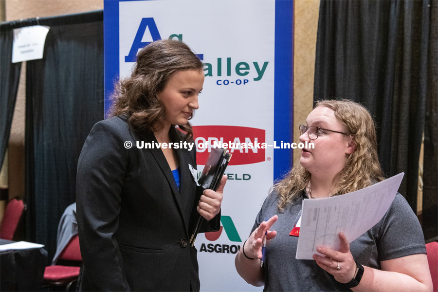 Madison Mills talks with a recruiter from Ag Valley Co-op at the STEM Career Fair (Science, Technology, Engineering, and Math) in Embassy Suites. Sponsored by Career Services. February 12th, 2019. Photo by Gregory Nathan / University Communication.