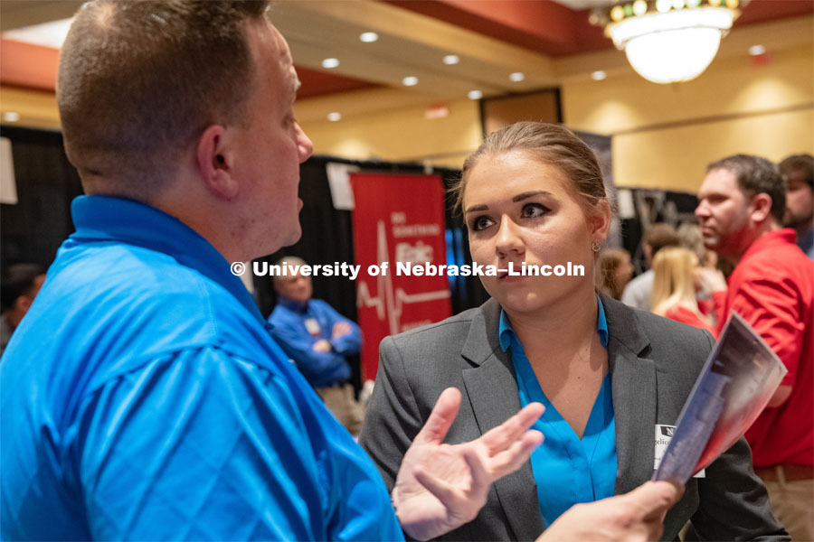 Angelica Wellman speaks with a recruiter at the STEM Career Fair (Science, Technology, Engineering, and Math) in Embassy Suites. Sponsored by Career Services. February 12, 2019. Photo by Gregory Nathan / University Communication.