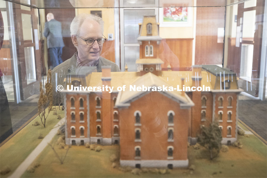 Mark Griep examines a model of University Hall presented as a gift of the class of 1887. Kay Logan Peters gives a special Nebraska Lecture as part of Charter Week on the University's early architectural history before a crowd of more than 300 people. February 12, 2019. Photo by Craig Chandler/University Communication.