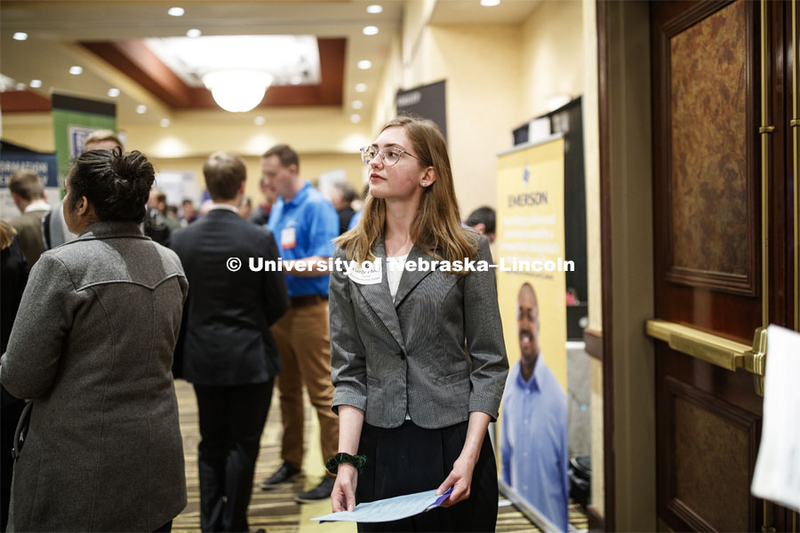 Carly Thody, a junior in environmental studies, look over the possibilities during day two of the Career Fair at Embassey Suites with emphasis on Science, Technology, Engineering and Mathematics. February 13, 2019.  Photo by Craig Chandler/University Communication.
