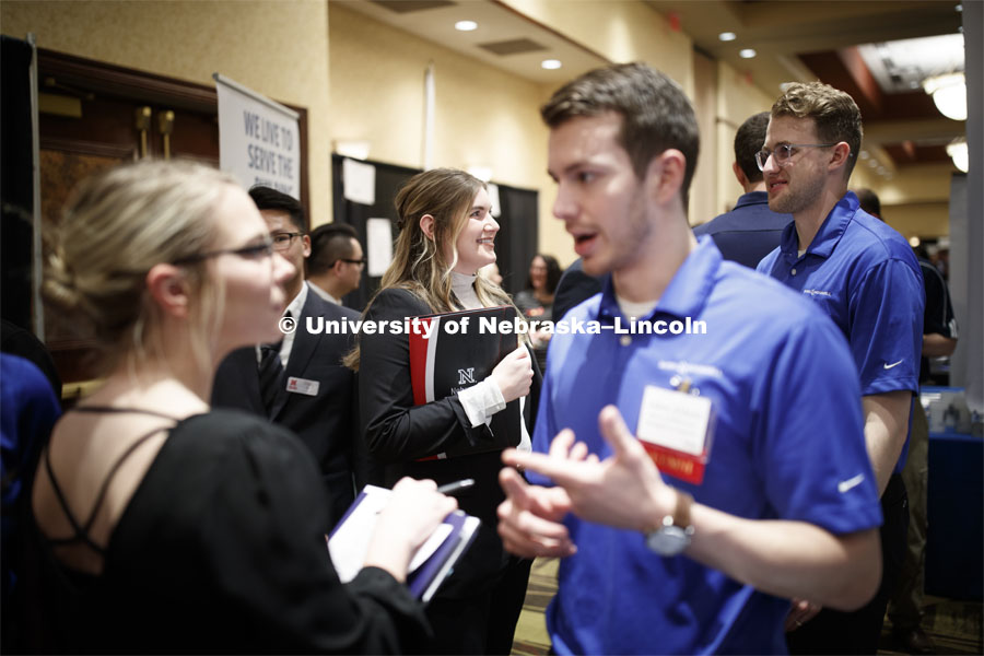 Allison Hauger, senior in Biological Systems Engineering, talks with a recruiter during day two of the Career Fair at Embassey Suites with emphasis on Science, Technology, Engineering and Mathematics. February 13, 2019.  Photo by Craig Chandler/University Communication.