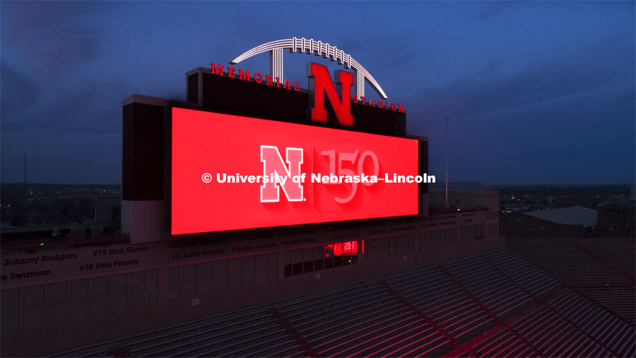 The University of Nebraska’s Memorial Stadium scoreboards lit up in red, proclaim the university's 150th birthday. February 13, 2019. Photo by Craig Chandler/University Communication.