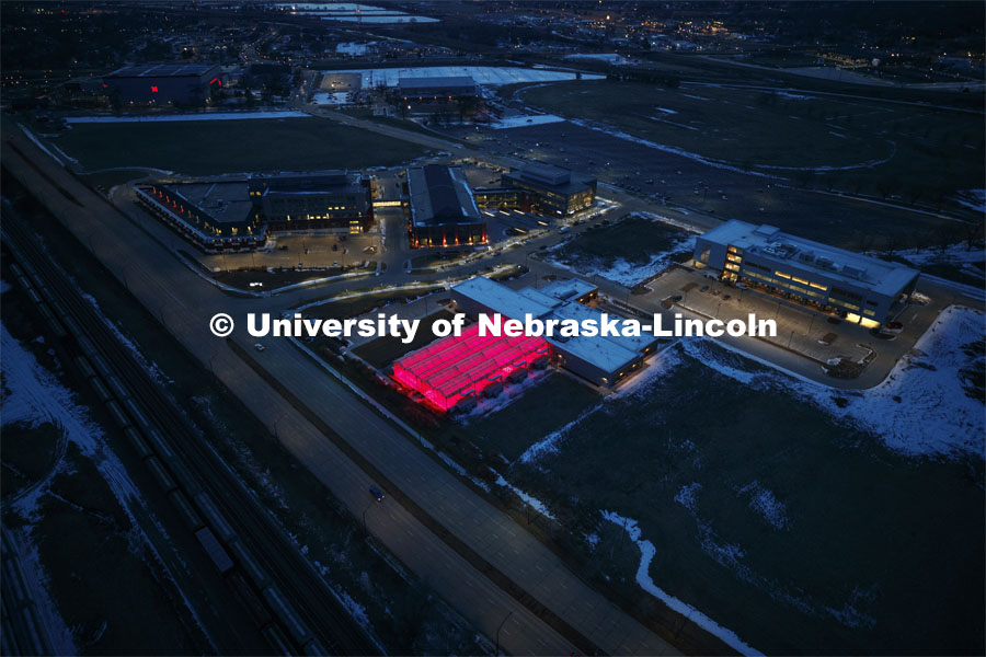 Aerial of Nebraska Innovation Campus lit up red for Glow Big Red. Glow Big Red bathes the campuses with red lights as part of N150's Charter Week celebration. February 14, 2019. Photo by Craig Chandler / University Communication.