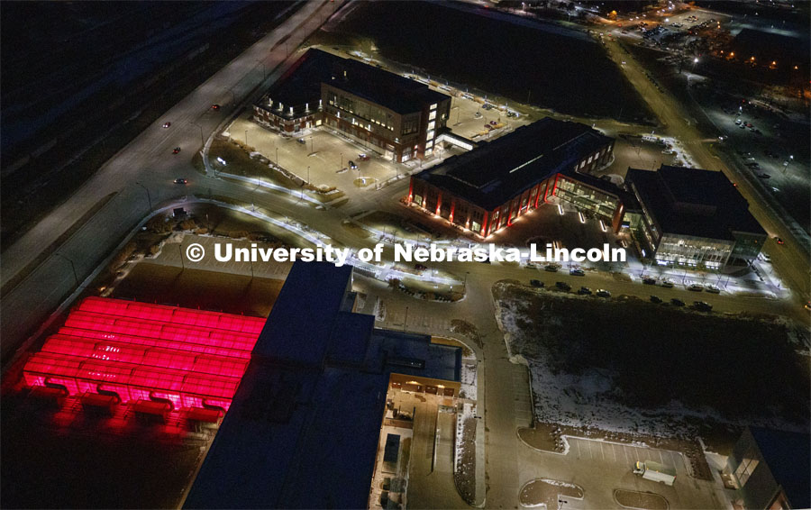 Aerial of Nebraska Innovation Campus lit up red for Glow Big Red. Glow Big Red bathes the campuses with red lights as part of N150's Charter Week celebration. February 14, 2019. Photo by Craig Chandler / University Communication.