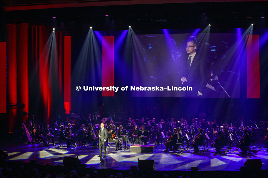 Jeff Zeleny introduces the Ted Kooser poem "This Is Nebraska" read by Dick Cavett on video. Charter Day Celebration: Music and Milestones in the Lied Center. Music and Milestones was a part of the N150 Charter Week celebration. February 15, 2019. Photo by Craig Chandler / University Communication.