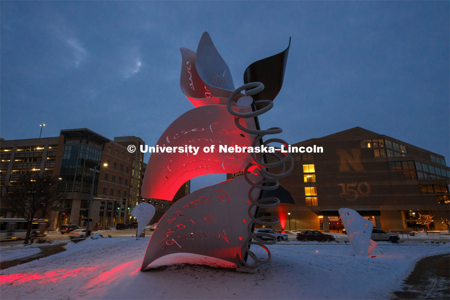 The Torn Notebook sculpture between the Lied and the visitor’s center glows red and is surrounded by fresh-fallen snow. Glow Big Red bathes the campuses with red lights as part of N150's Charter Week celebration. February 15, 2019. Photo by Craig Chandler / University Communication.