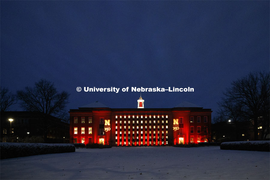 Love Library glows in the celebration and is surrounded by fresh-fallen snow. Glow Big Red bathes the campuses with red lights as part of N150's Charter Week celebration. February 15, 2019. Photo by Craig Chandler / University Communication.