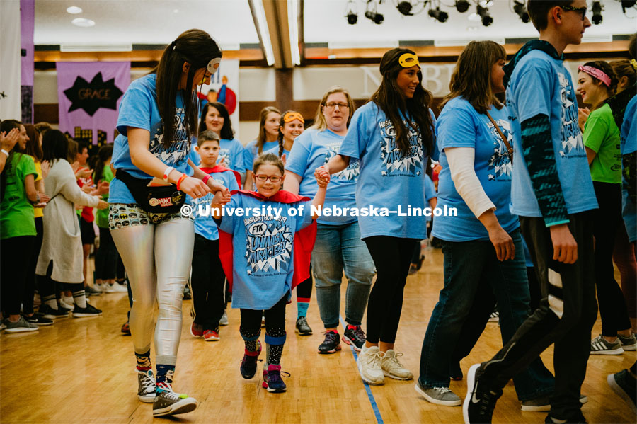 Dance Marathon attendees form a tunnel for the Miracle kids to run through. Miracle kids shown with their college partners. 1274 Nebraska students signed up to be part of the Huskerthon Dance Marathon for Children's Hospital in Omaha. February 16, 2019. Photo by Justin Mohling / University Communication.