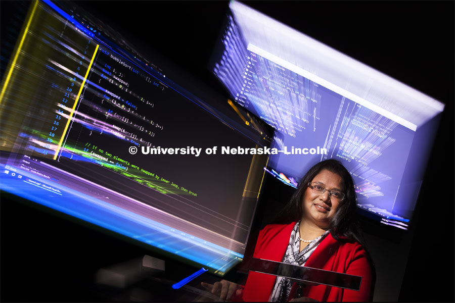 In a world where computer code is overwhelming, Nebraska computer scientist Bonita Sharif assistant professor of computer science and engineering at Nebraska University, is using the latest advances in eye-tracking technology to analyze how experienced software programmers work in order to develop tools that help them write code better and faster. She has earned a $432,000 Faculty Early Career Development Program award from the National Science Foundation to fund the research and related student workshops. The eye-tracking hardware is the small bar on the table in front of Sharif. February 21, 2019. Photo by Craig Chandler / University Communication.