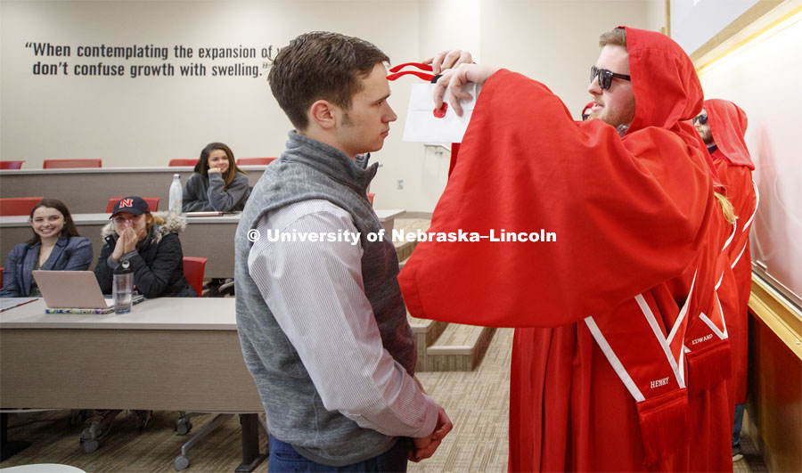 The Innocents Society taps Spencer Nussrallah, junior in finance, into the society Monday morning during a business class. February 25, 2019. Photo by Craig Chandler / University Communication.