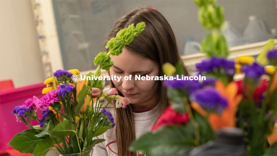 A student completes a spray during Stacy Adams floral design class. Hort 261- Floral Design 1, in Plant Sciences Hall. Students create floral arrangements. February 26, 2019. Photo by Gregory Nathan / University Communication.