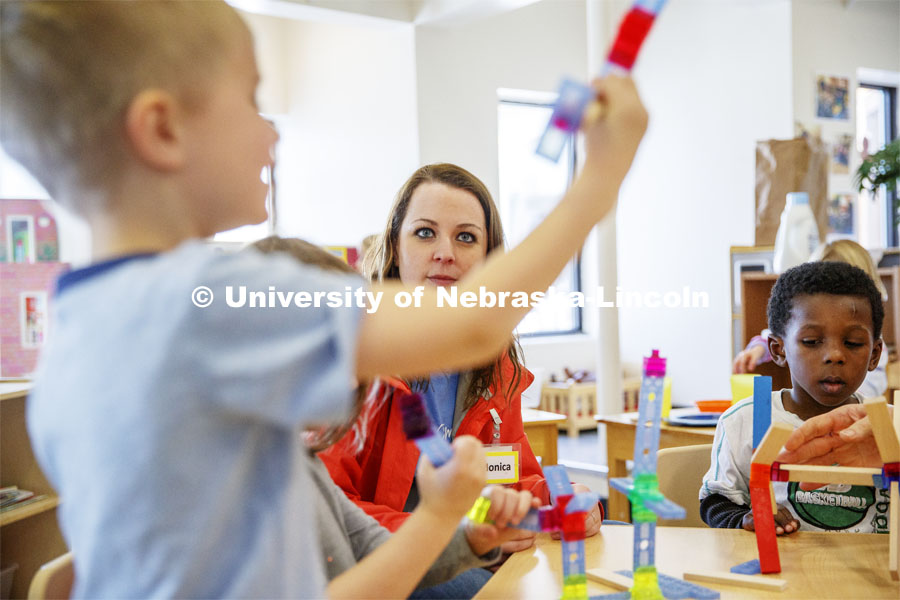 Monica Meyer, senior in Inclusvie Child Youth and Family Studies, works with children at the Malone Center. Ruth Staples Child Development Lab student teachers and children work with children at the Malone Center. Febrary 28, 2019. Photo by Craig Chandler / University Communication