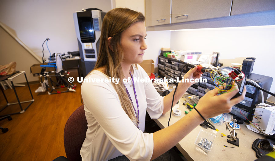 Alex Hruby, Senior in Biological Systems Engineering, works on her research project in the Institute for Rehabilitation Science and Engineering at Madonna Rehabilitation Hospital's Lincoln campus. The device will help low mobility patients communicate with the nursing staff while in the hospital. March 12, 2019. Photo by Craig Chandler / University Communication.
