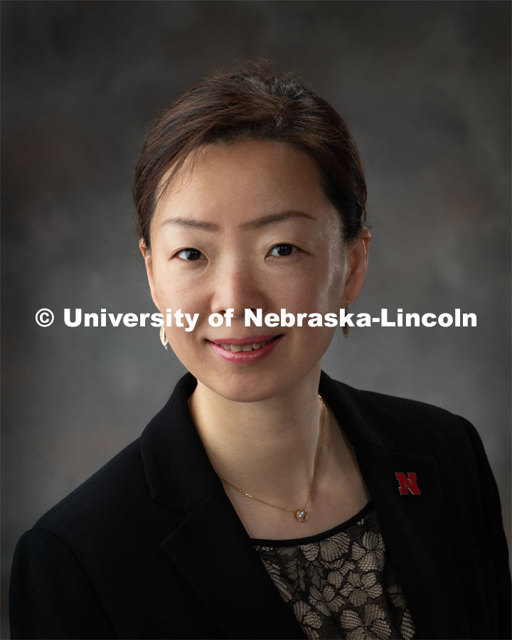 Studio portrait of Bing Cheng, Visiting Scholar, Confucius Institute. March 15, 2019. Photo by Greg Nathan, University Communication.