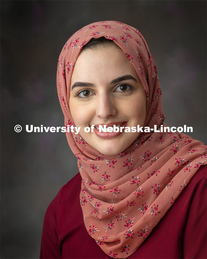 Studio portrait of Seima Al-Momani, grad student, Psychology. March 27, 2019. Photo by Greg Nathan / University Communication.