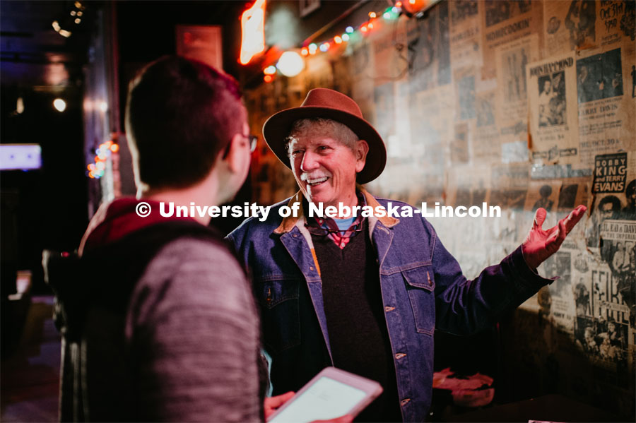 River Towne (left) talks with a Zoo Bar patron during the History Harvest event. University of Nebraska–Lincoln students enrolled in the History Harvest course spent time March 31 meeting with Zoo Bar patrons, musicians and staff — both current and former — to record oral histories, photograph and archive memorabilia and practice first-hand the techniques of preserving the past. March 31, 2019. Photo by Justin Mohling for University Communication.